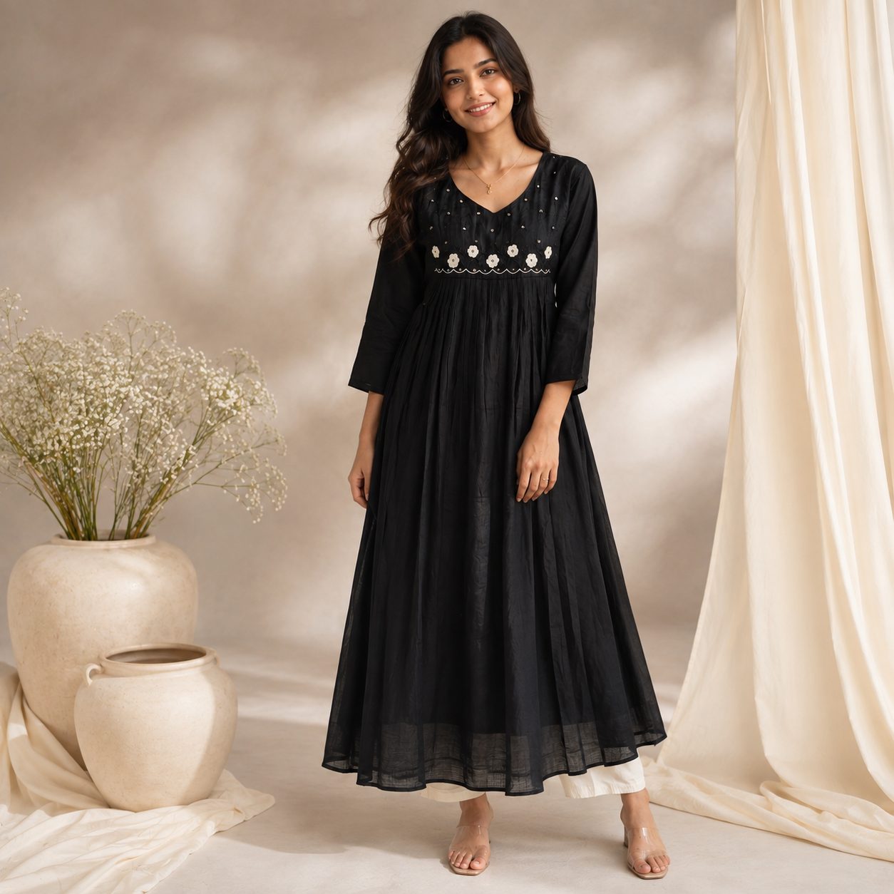 Black A-line two piece kurta set featuring delicate white floral embroidery